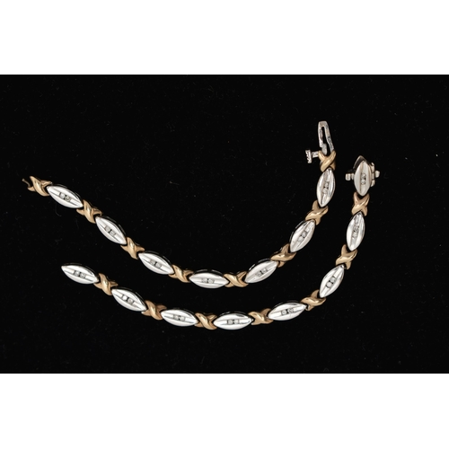 88 - A 9CT GOLD DIAMOND LINE BRACELET, AF designed as an alternating white gold oval links each set with ... 