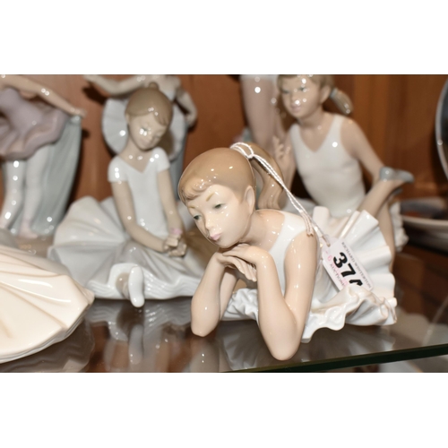 374 - NINE NAO FIGURES OF BALLERINAS, in different poses, tallest standing ballerina holding shoes 29cm, o... 