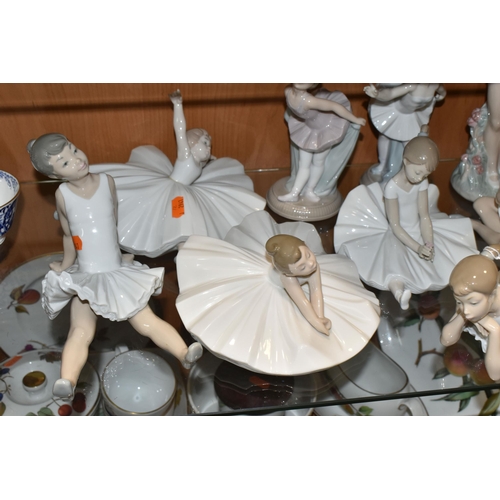 374 - NINE NAO FIGURES OF BALLERINAS, in different poses, tallest standing ballerina holding shoes 29cm, o... 