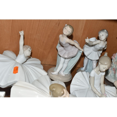 374 - NINE NAO FIGURES OF BALLERINAS, in different poses, tallest standing ballerina holding shoes 29cm, o... 