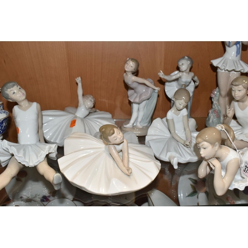 374 - NINE NAO FIGURES OF BALLERINAS, in different poses, tallest standing ballerina holding shoes 29cm, o... 