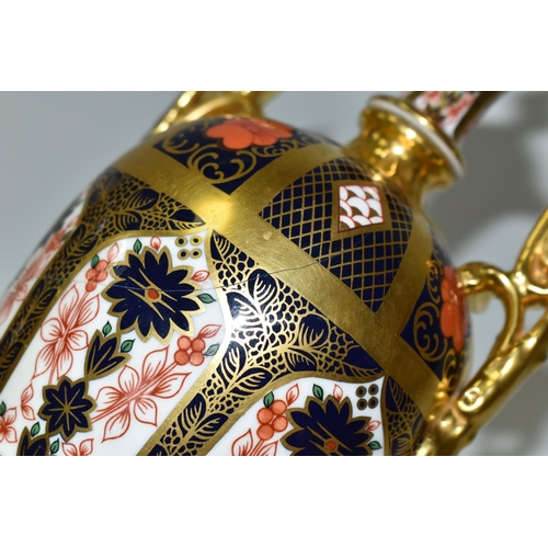 378 - A ROYAL CROWN DERBY 'IMARI 1128 SOLID GOLD' BAND TWIN HANDLED VASE AND FIXED COVER, short pedestal a... 