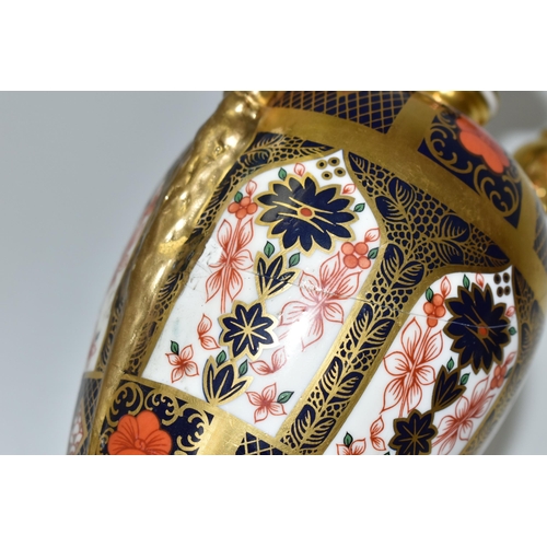 378 - A ROYAL CROWN DERBY 'IMARI 1128 SOLID GOLD' BAND TWIN HANDLED VASE AND FIXED COVER, short pedestal a... 