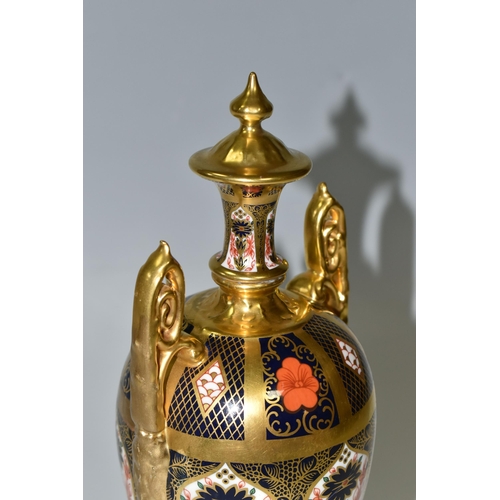 378 - A ROYAL CROWN DERBY 'IMARI 1128 SOLID GOLD' BAND TWIN HANDLED VASE AND FIXED COVER, short pedestal a... 