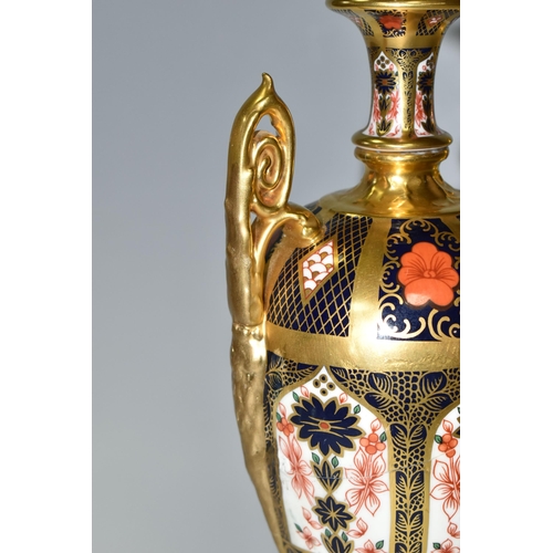 378 - A ROYAL CROWN DERBY 'IMARI 1128 SOLID GOLD' BAND TWIN HANDLED VASE AND FIXED COVER, short pedestal a... 