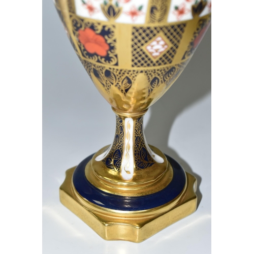 378 - A ROYAL CROWN DERBY 'IMARI 1128 SOLID GOLD' BAND TWIN HANDLED VASE AND FIXED COVER, short pedestal a... 