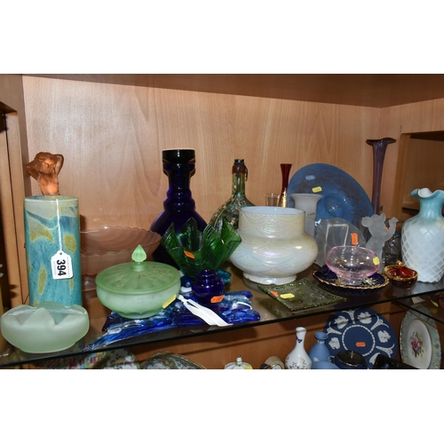 394 - A COLLECTION OF COLOURED GLASSWARE, comprising two pale blue satin quilted air - trap vases, height ... 