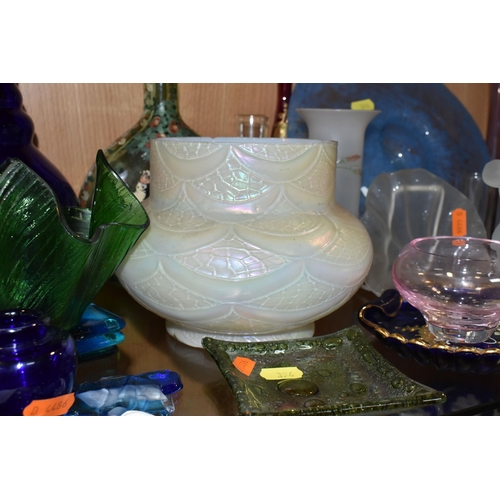 394 - A COLLECTION OF COLOURED GLASSWARE, comprising two pale blue satin quilted air - trap vases, height ... 