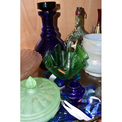 394 - A COLLECTION OF COLOURED GLASSWARE, comprising two pale blue satin quilted air - trap vases, height ... 