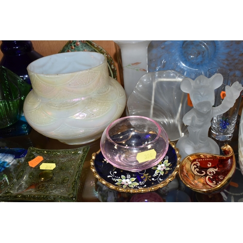 394 - A COLLECTION OF COLOURED GLASSWARE, comprising two pale blue satin quilted air - trap vases, height ... 