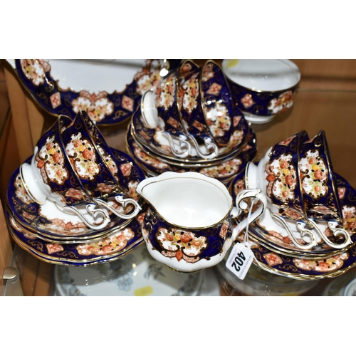 402 - A GROUP OF ROYAL ALBERT 'HEIRLOOM' PATTERN TEAWARE, comprising a milk jug, cake plate (small hairlin... 