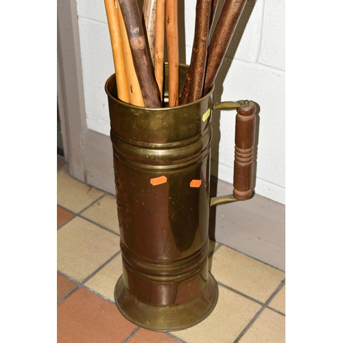 456 - A COLLECTION OF WALKING STICKS, a metal stick stand containing ten assorted walking sticks and a bac... 