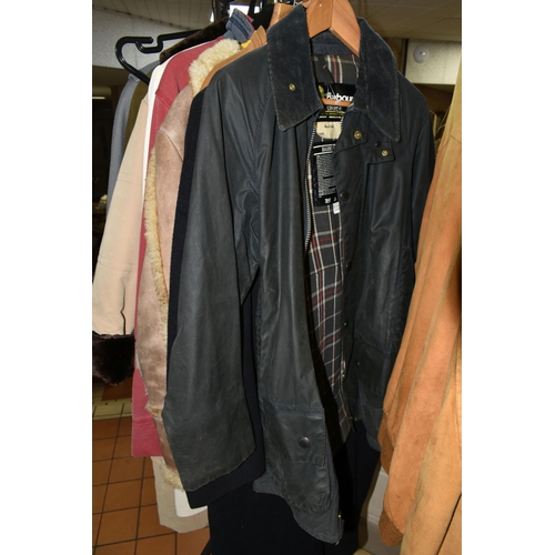 511 - A QUANTITY OF VINTAGE CLOTHING AND ACCESSORIES, to include a navy blue Barbour 'Beaufort' wax jacket... 