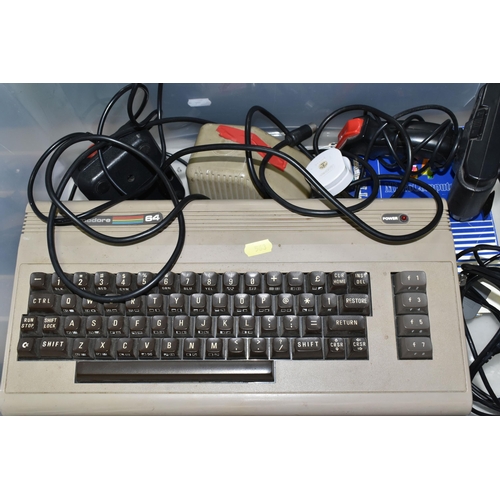 563 - COMMODORE 64 AND A QUANTITY OF GAMES, games include but are not limited to Konami's Coin Op Hits, Pa... 