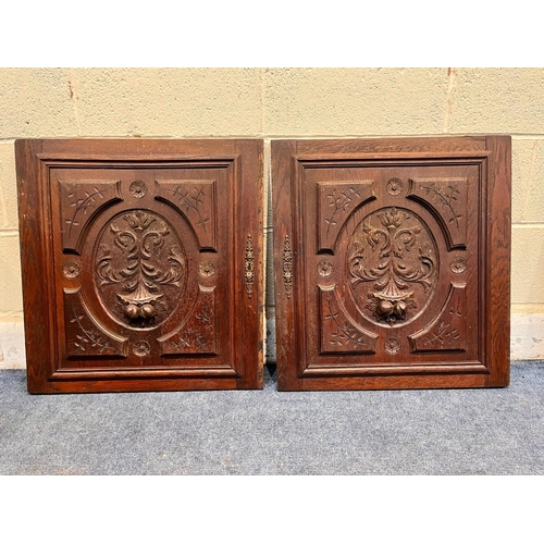 1321 - TWO PAIRS OF 20TH CENTURY MAHOGANY PANELED DOORS, and a single door, all with carved foliate detail,... 