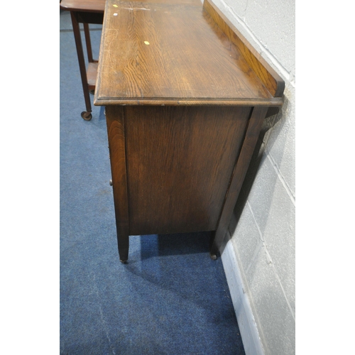 1214 - A 20TH CENTURY OAK CHEST OF THREE DRAWERS, on square tapered legs and ceramic castors, width 89cm x ... 