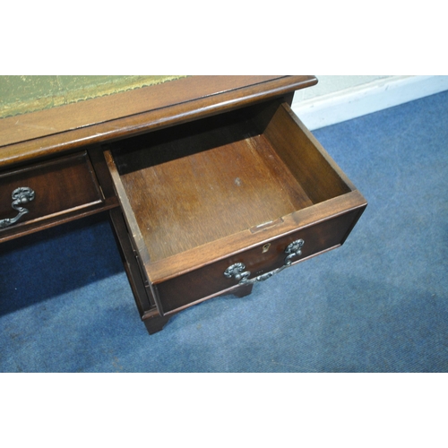 1216 - A 20TH CENTURY MAHOGANY PEDESTAL DESK, with a green tooled leather writing surface, fitted with an a... 