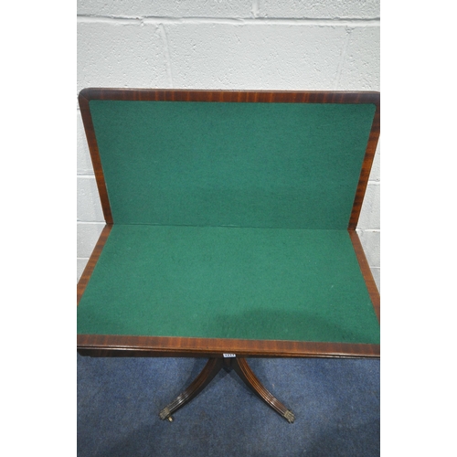 1217 - A BEVAN FUNNELL REPRODUX MAHOGANY FOLD OVER GAMES TABLE, the top enclosing a green playing baize and... 