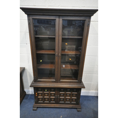 1223 - A YOUNGER TOLEDO OAK SIDEBOARD, with three drawers above four cupboard doors, length 207cm x depth 4... 