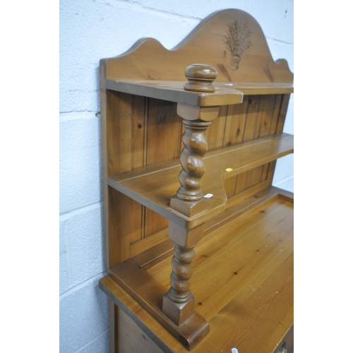 1247 - A MODERN PINE DRESSER, the top three tier plate rack with wheat decoration to crest, each shelf on b... 