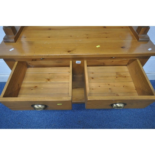 1247 - A MODERN PINE DRESSER, the top three tier plate rack with wheat decoration to crest, each shelf on b... 