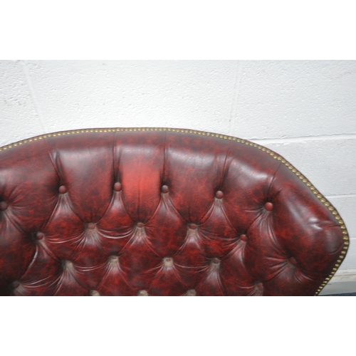 1262 - A BURGUNDY LEATHER BUTTONED ARMCHAIR, with brass studded detail, width 100cm x depth 97cm x height 1... 