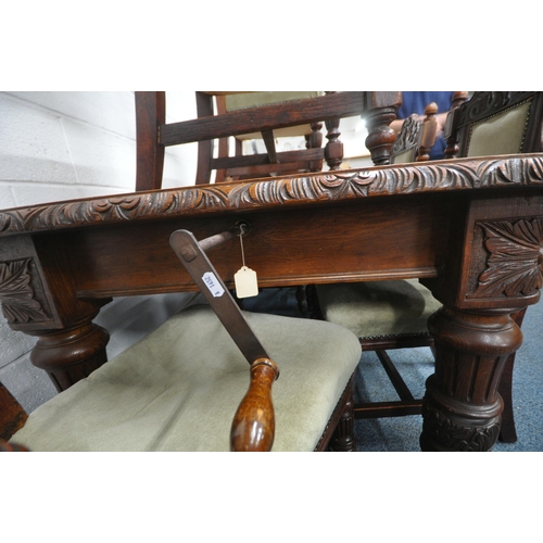 1270 - AN EDWARDIAN OAK WIND OUT DINING TABLE, with canted corners, turned and fluted legs, on ceramic cast... 