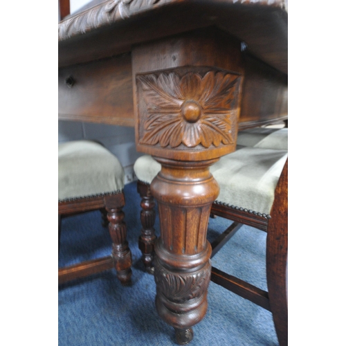 1270 - AN EDWARDIAN OAK WIND OUT DINING TABLE, with canted corners, turned and fluted legs, on ceramic cast... 