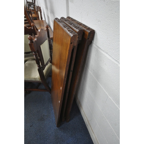 1270 - AN EDWARDIAN OAK WIND OUT DINING TABLE, with canted corners, turned and fluted legs, on ceramic cast... 