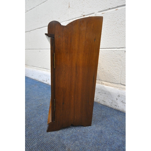 1283 - A 20TH CENTURY OAK SMOKERS CABINET, with raised top section, two bevelled glass doors enclosing thre... 