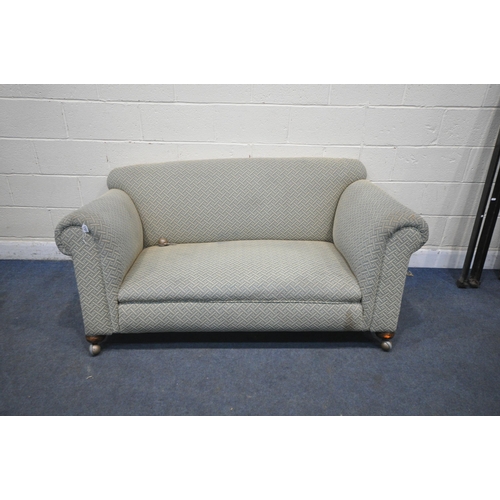 1337 - A 19TH CENTURY TWO SEATER SOFA, with blue and beige upholstery, on front bun feet and castors, lengt... 