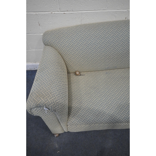 1337 - A 19TH CENTURY TWO SEATER SOFA, with blue and beige upholstery, on front bun feet and castors, lengt... 