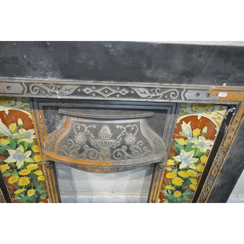 1339 - A CAST IRON FIRE SURROUND, the tiled inserts depicting flowers in a vase, width 102cm x height 99cm,... 