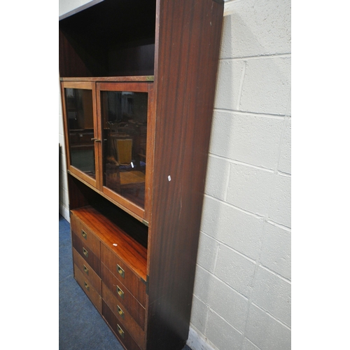 1341 - A MODERN MAHOGANY CAMPAIGN BOOKCASE, with two glazed doors and eight drawers, width 101cm x depth 36... 