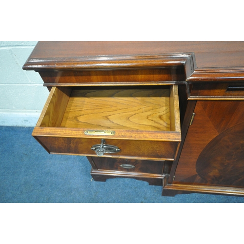 1345 - A MODERN MAHOGANY BREAKFRONT SIDEBOARD, fitted with two drawers, four cupboard doors and a brushing ... 