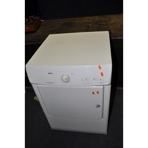 1063 - A ZANUSSI ZDE47201W TUMBLE DRYER width 60cm depth 64cm height 85cm, an unbranded tower heater and a ... 