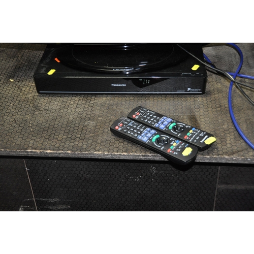 1064 - A PANASONIC TX-L26C10B 26in TV with remote and a Panasonic DMR-EX97 DVD player with remote (both PAT... 