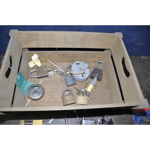 1074 - A BASKET CONTAINING USED AND NEW PADLOCKS most with one key of various makes, styles and sizes and f... 