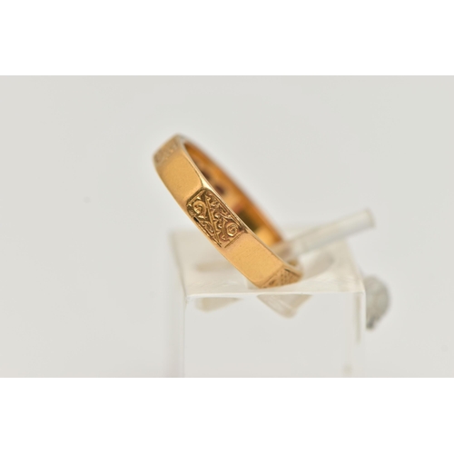 14 - A 22CT GOLD BAND RING, a decagon style band ring with etched scrolling detail, approximate band widt... 