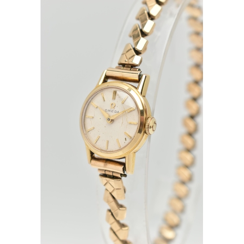 28 - A LADYS 'OMEGA' WRISTWATCH, manual wind, round silver dial signed 'Omega', baton markers, gold tone ... 