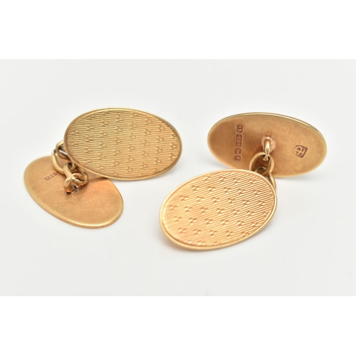 3 - A PAIR OF 15CT GOLD CUFFLINKS, designed as oval engine turned panels with chain link connectors, 15c... 