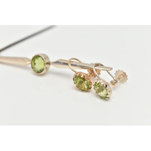 63 - A PERIDOT BAR BROOCH AND EARRINGS, an oval cut peridot collet set in yellow metal with milgran detai... 