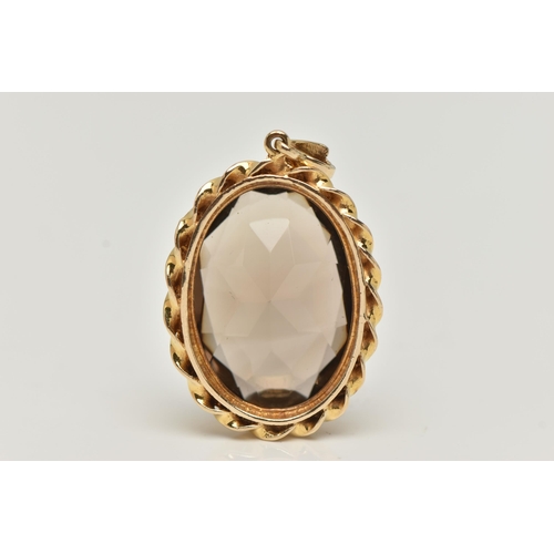 67 - A 9CT GOLD SMOKEY QUARTZ PENDANT, set with an oval shaped mixed cut smoky quartz, within a rope twis... 