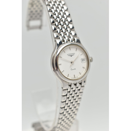 107 - TWO WRISTWATCHES, the first a boxed a ladys quartz movement, round white dial, signed Longines, bato... 