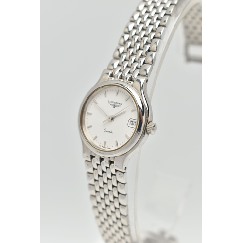 107 - TWO WRISTWATCHES, the first a boxed a ladys quartz movement, round white dial, signed Longines, bato... 