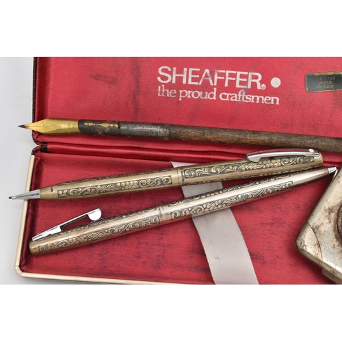 116 - SIX PENS, to include a Sheaffer pen and retractable pencil set with engraved scrolling foliage decor... 