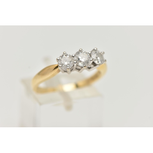 96 - AN 18CT GOLD DIAMOND THREE STONE RING, three round brilliant cut diamonds, each claw set in a white ... 