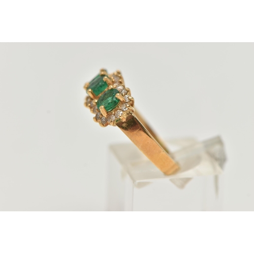 98 - AN 18CT GOLD EMERALD AND DIAMOND RING, designed as three claw set, oval cut emeralds, heavily includ... 