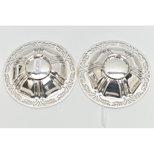 121 - A PAIR OF GEORGE V SILVER CIRCULAR BONBON DISHES, with gadrooned rims and foliate pierced borders, l... 