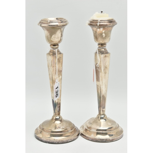 136 - A PAIR OF SILVER CANDLE STICKS, tapered square columns on round weighted bases, hallmarks rubbed 'Sa... 